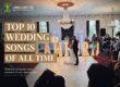 Bride and groom sharing their first dance with guests at a wedding reception – Top 10 Wedding Songs of All Time