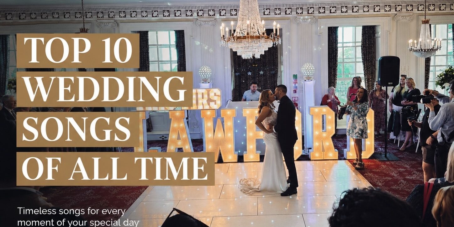 top_10_wedding_songs_of_all_time Bride and groom sharing their first dance with guests at a wedding reception – Top 10 Wedding Songs of All Time